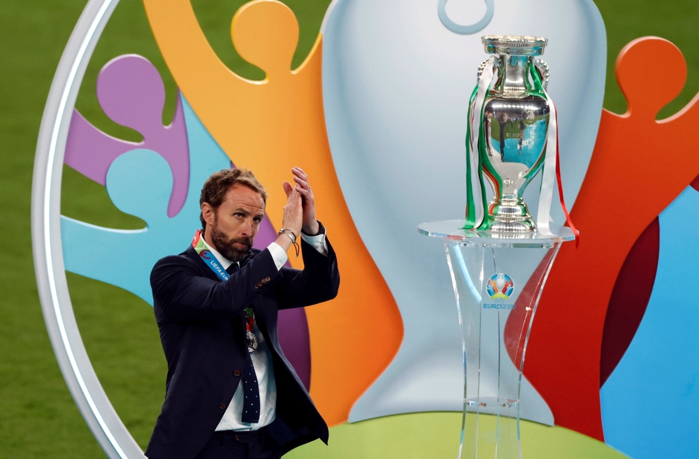 England manager Gareth Southgate applauds fans after the match next to the trophy Pool via REUTERS/John Sibley 