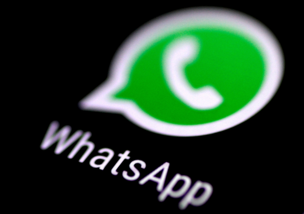 FILE PHOTO: The WhatsApp messaging application is seen on a phone screen August 3, 2017. REUTERS/Thomas White