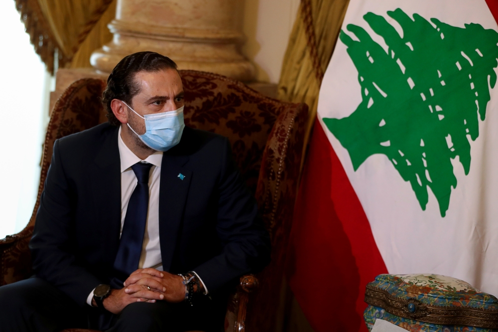 Lebanese Prime Minister-designate Saad al-Hariri looks on as he meets with Egyptian Foreign Minister Sameh Shoukry at Tahrir Palace in Cairo, Egypt July 14, 2021. (Reuters/Mohamed Abd El Ghany)