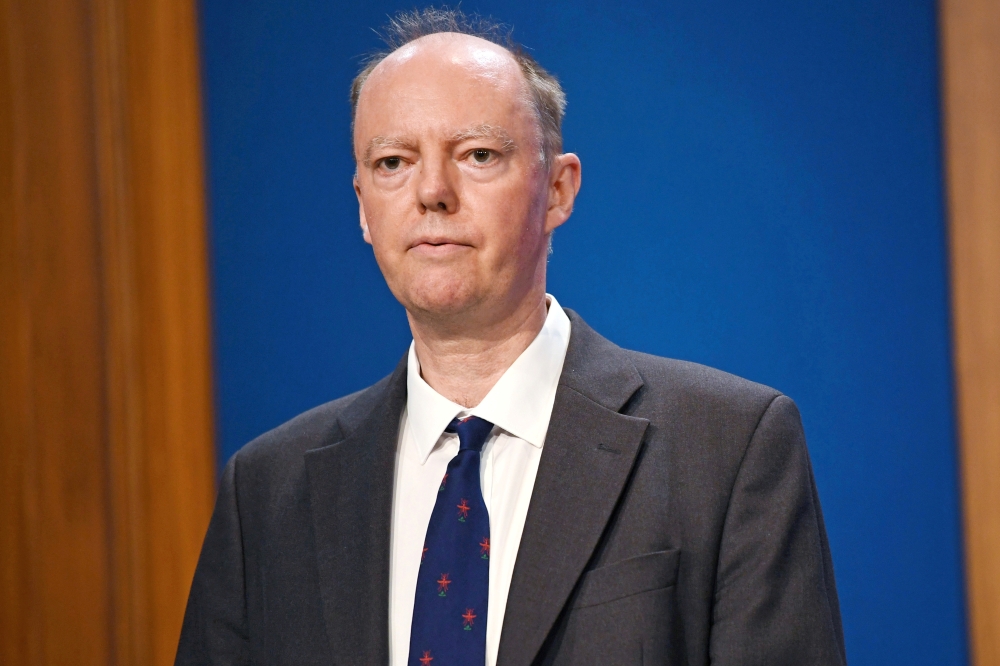 Britain's Chief Medical Officer for England Chris Whitty looks on at a news conference as he gives an update on relaxing restrictions imposed on the country during the coronavirus disease (COVID-19) pandemic inside the Downing Street Briefing Room in Lond