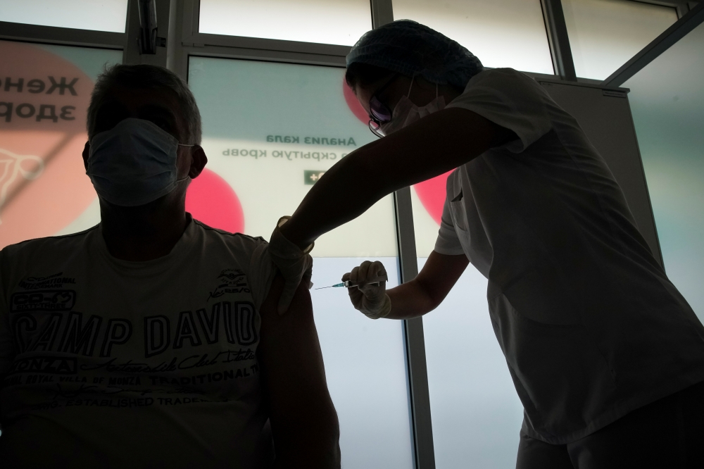 A man receives a dose of Sputnik V (Gam-COVID-Vac) vaccine against the coronavirus disease (COVID-19) in Moscow, Russia July 15, 2021. REUTERS/Tatyana Makeyeva