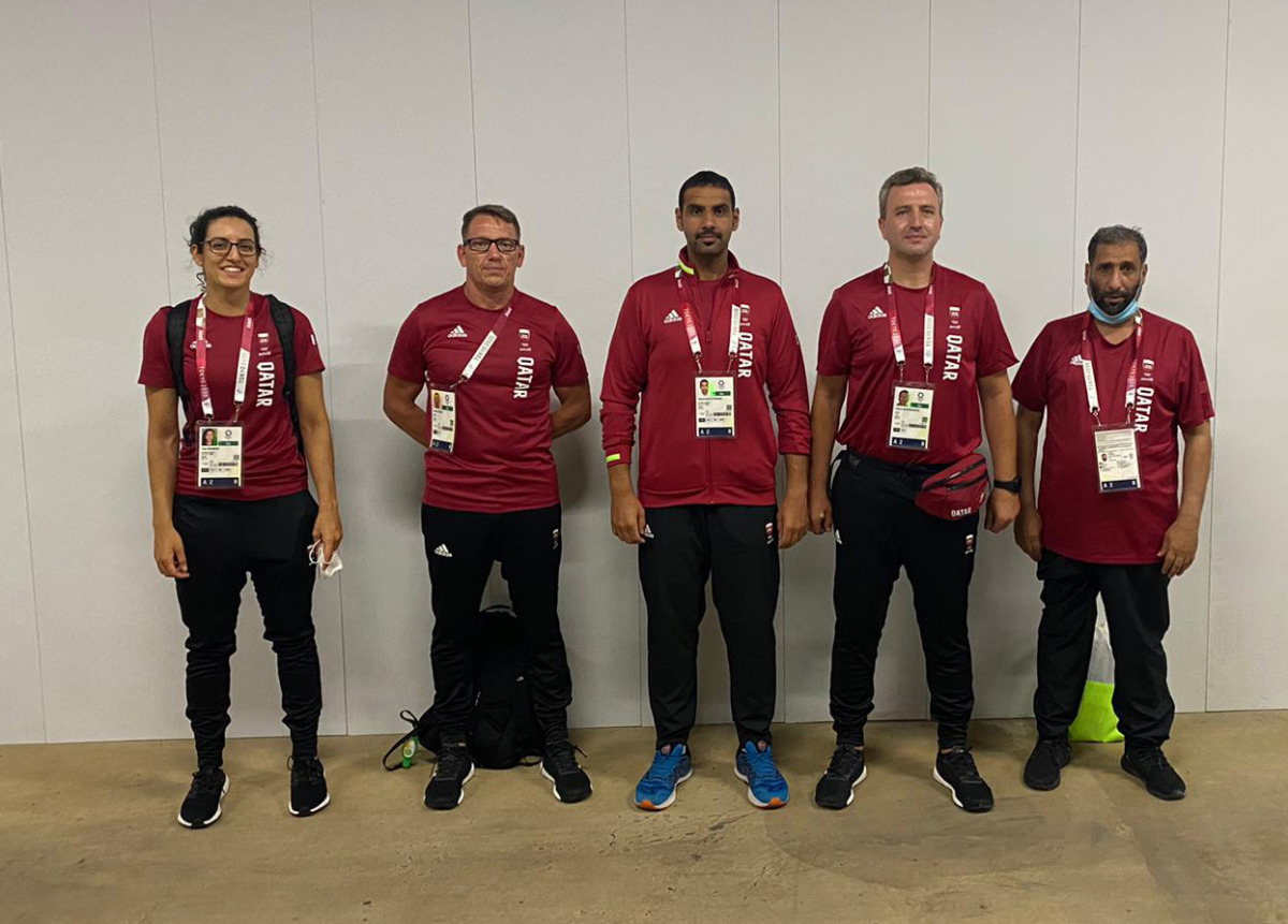 Qatar's Mohamed Al Rumaihi (centre) and Tala Abujbara (left ) in Tokyo, Japan.