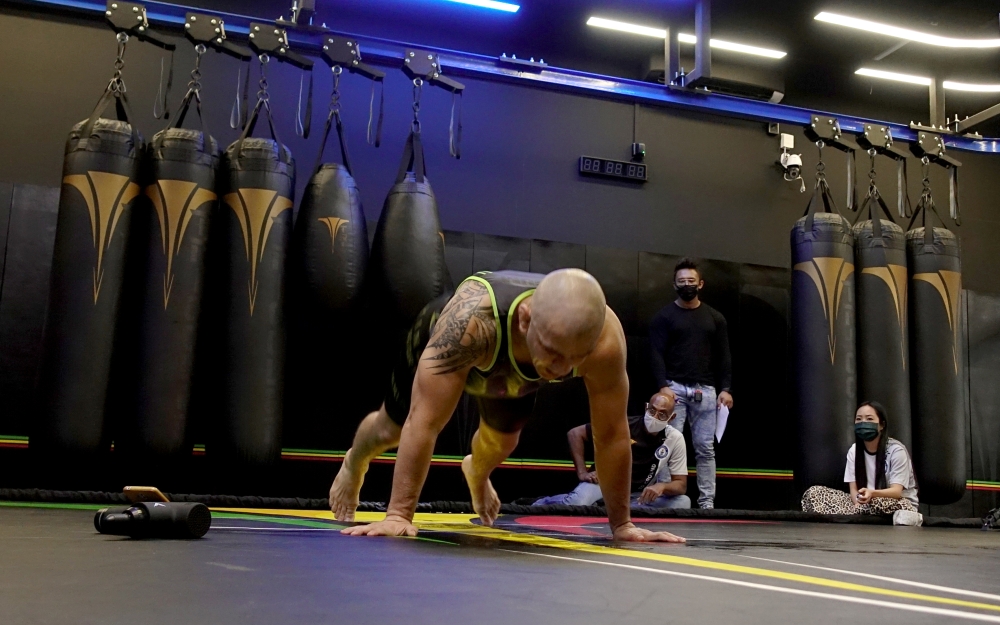 Cassiano Rodrigues Laureano breaks Guinness World Record of most number of burpees in 60 minutes, in Singapore July 20, 2021. REUTERS/Joseph Campbell