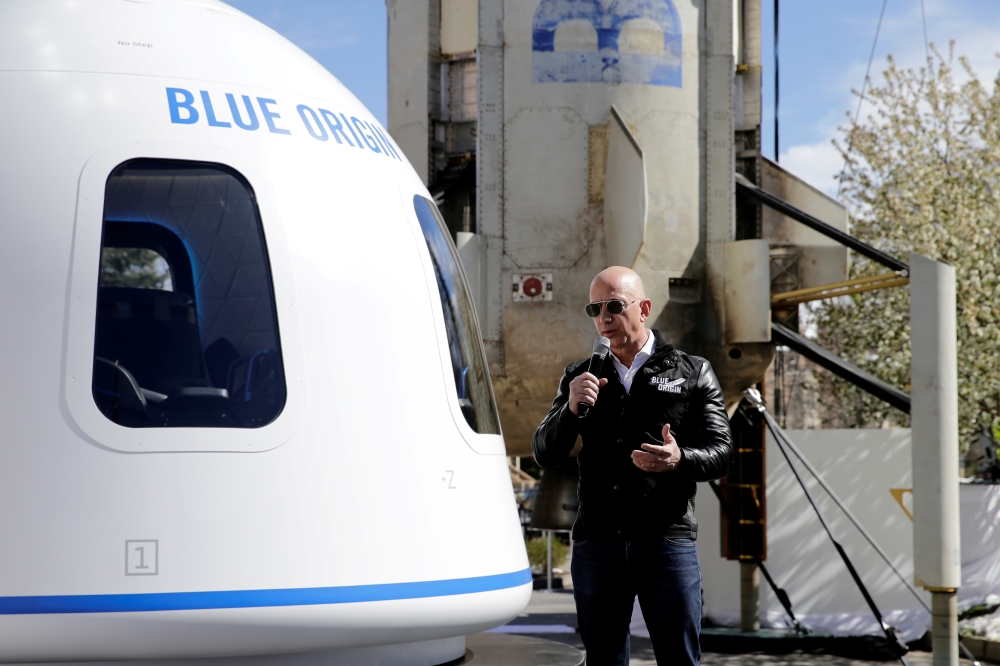 Amazon and Blue Origin founder Jeff Bezos addresses the media about the New Shepard rocket booster and Crew Capsule mockup at the 33rd Space Symposium in Colorado Springs, Colorado, United States April 5, 2017. (REUTERS/Isaiah J. Downing/File Photo)