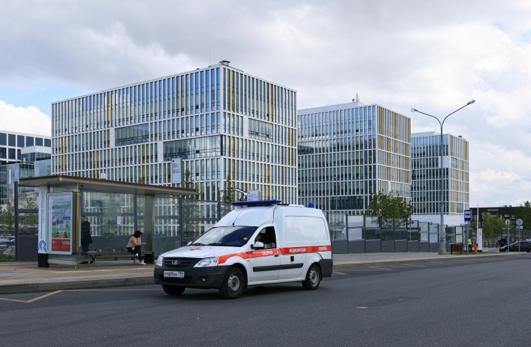 An ambulance drives near a hospital for patients infected with the coronavirus disease (COVID-19) on the outskirts of Moscow, Russia July 2, 2021. REUTERS/Tatyana Makeyeva

