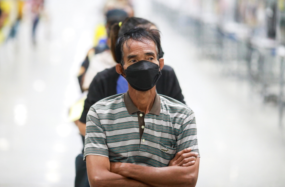 People queue at the Central Vaccination Center as Thailand opens walk-in for first dose of the AstraZeneca vaccination scheme for elders, people with a minimum weight of 100 kilograms and pregnant women amid the coronavirus (COVID-19) outbreak in Bangkok,