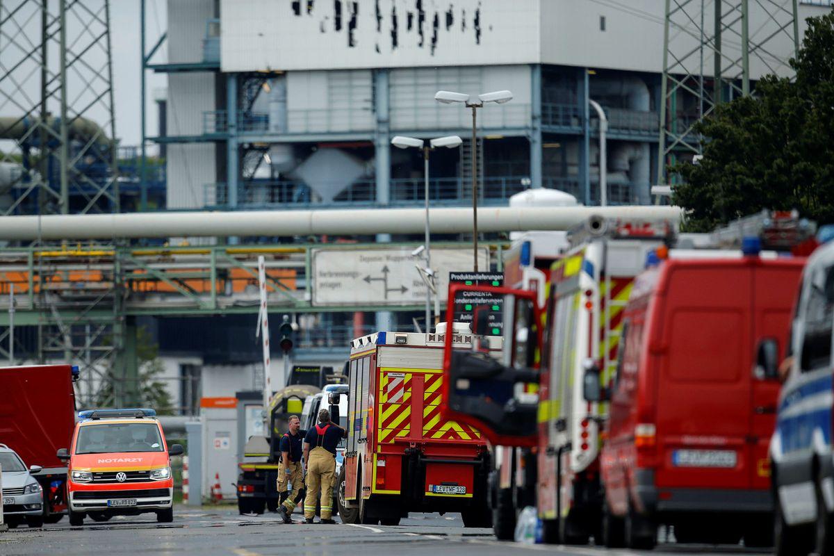 Firefighters stand outside Chempark following an explosion in Leverkusen, Germany, July 27, 2021. REUTERS/Leon Kuegeler