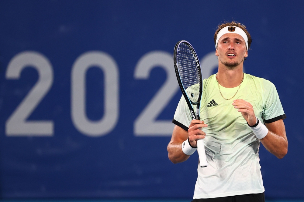 July 30, 2021. Alexander Zverev of Germany reacts after winning his semifinal match against Novak Djokovic of Serbia REUTERS/Mike Segar