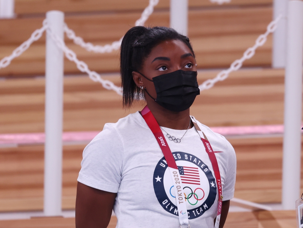 Simone Biles of the United States wearing a protective face mask looks on. Reuters/Mike Blake