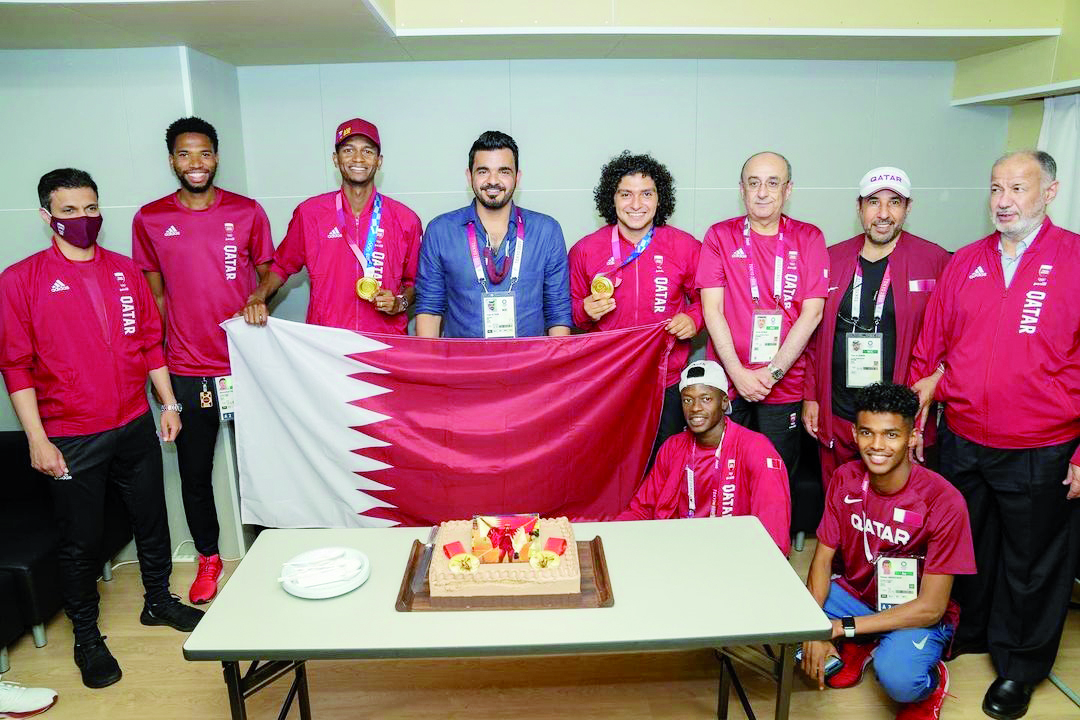Qatar Olympic Committee President Sheikh Joaan bin Hamad Al Thani, Qatar Athletics Federation President Dr Thani bin Abdulrahman Al Kuwari, officials and Team Qatar athletes pose for a photograph as they celebrate the gold medals won by Mutaz Barshim and 