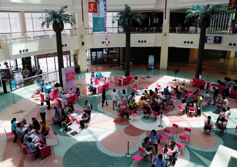 People receive the Sinovac COVID-19 vaccine as the Thai resort island of Phuket rushes to vaccinate its population amid the coronavirus disease (COVID-19) outbreak, and ahead of a July 1 ending of strict quarantine for overseas visitors, to bring back tou