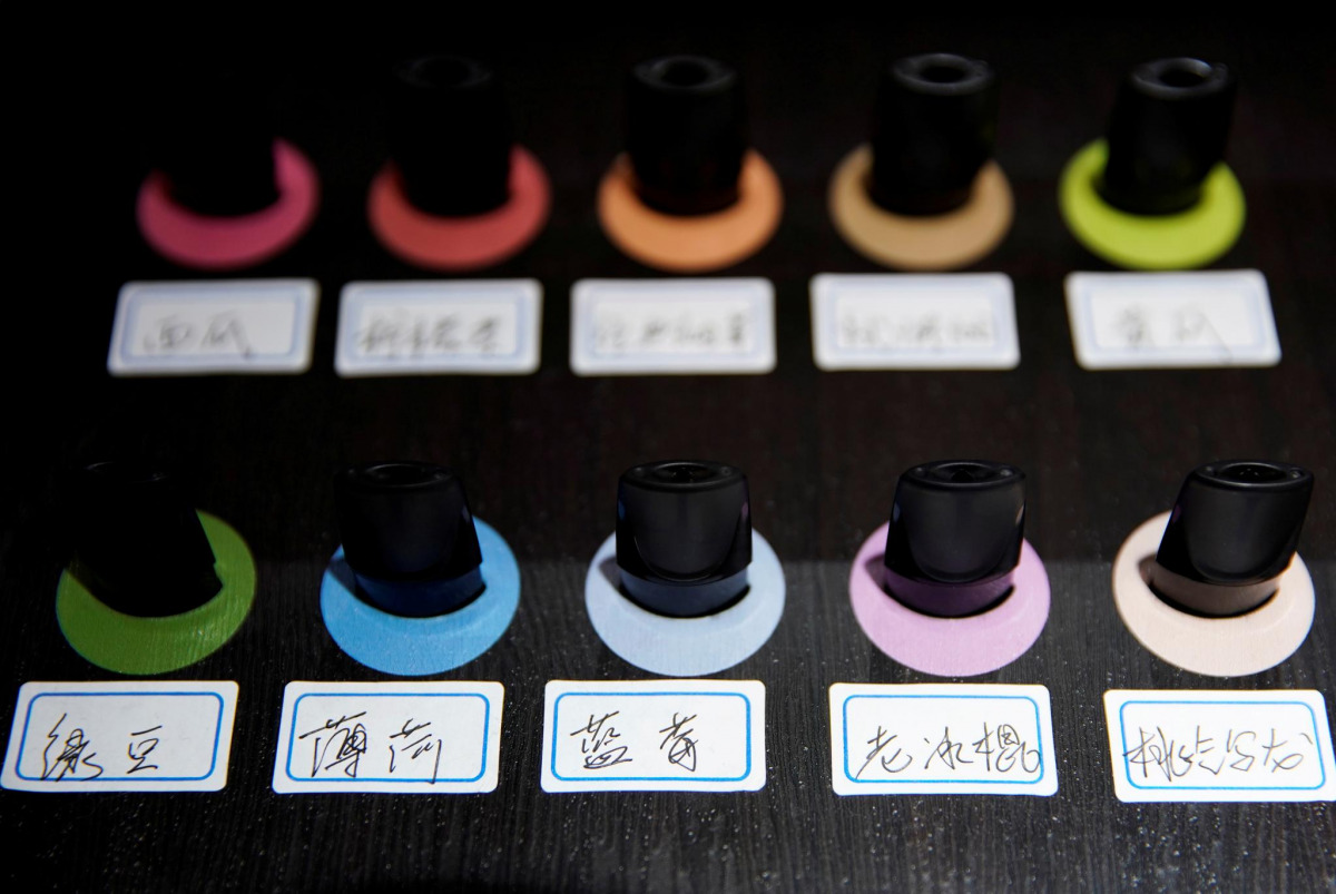 FILE PHOTO: Pods of different flavors are seen on display at an authorized reseller store of Chinese e-cigarette company Relx in Shanghai, China July 24, 2019. REUTERS/Aly Song/File Photo

