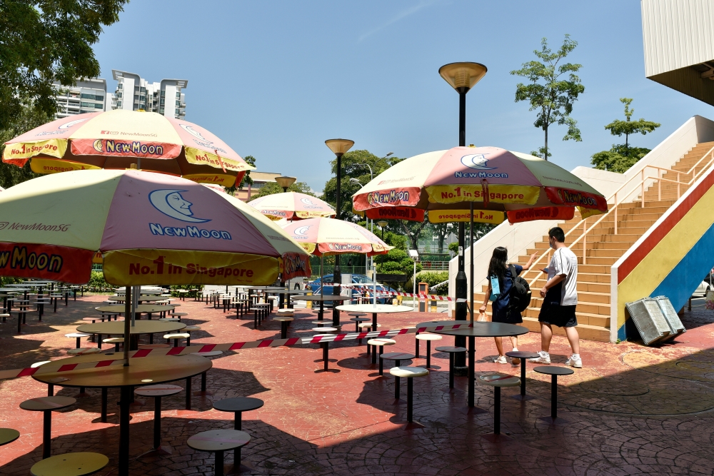The seating area at a food centre is cordoned off to restrict dining-in as part of the latest measures to curb the coronavirus disease (COVID-19) outbreak in Singapore July 23, 2021. REUTERS/Caroline Chia/File Photo
