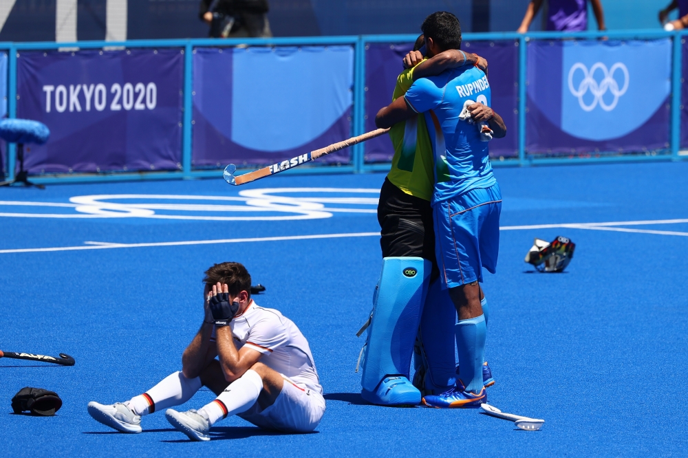Sreejesh Parattu Raveendran of India and Rupinder Pal Singh of India celebrate winning their match for the bronze medal. Reuters/Hamad I Mohammed