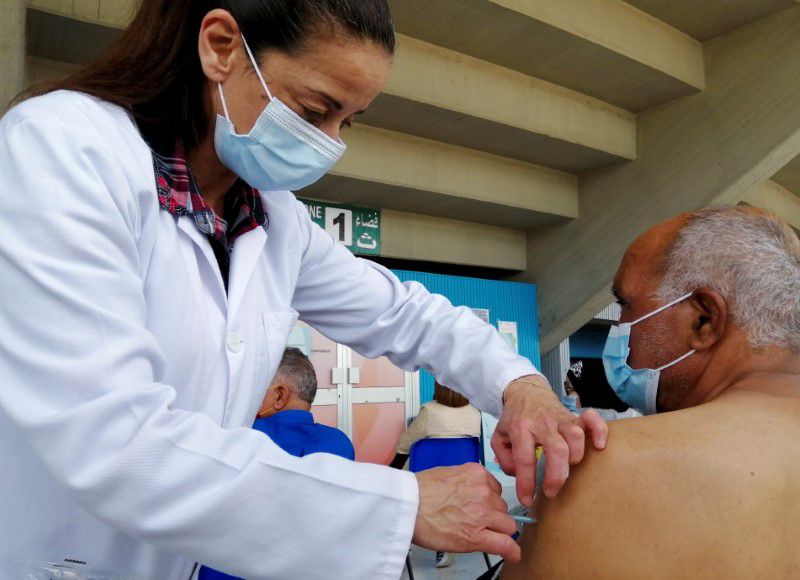 FILE PHOTO: A man receives a coronavirus disease (COVID-19) vaccine at a vaccination centre in Tunis, Tunisia, April 26, 2021. REUTERS/Jihed Abidellaoui


