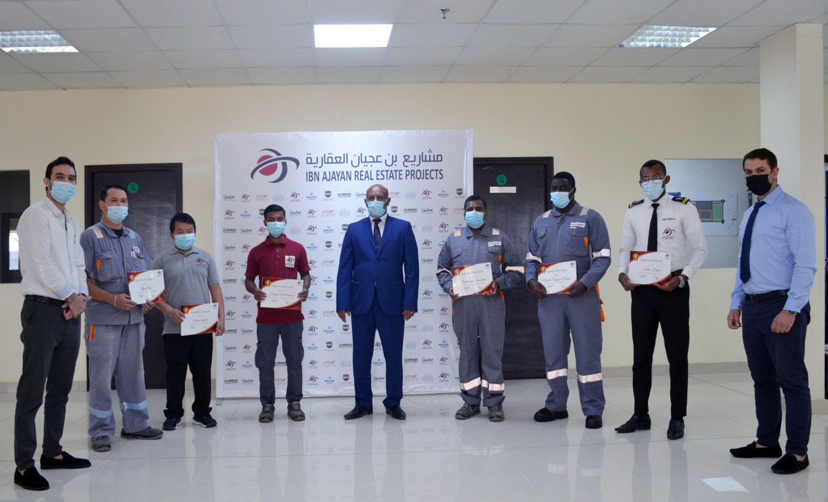 Employees of IAP Real Estate Projects with their ‘Employees of the Month’ awards.