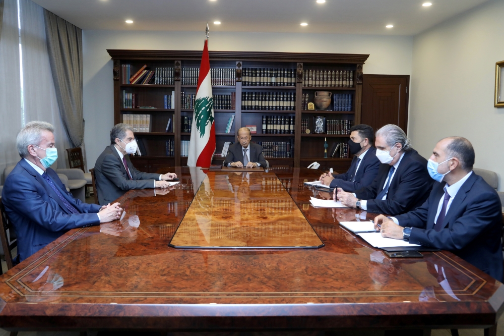 Lebanon's President Michel Aoun meets with Central Bank Governor Riad Salameh, caretaker Energy Minister Raymond Ghajar and caretaker Finance Minister Ghazi Wazni at the presidential palace in Baabda, Lebanon August 12, 2021. Dalati Nohra/Handout via Reut