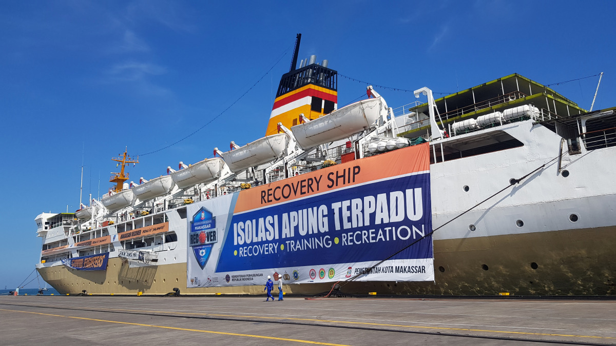 A giant banner reading 'Recovery Ship: Integrated Floating Isolation - Recovery, Training, Recreation' is seen on a passenger ship owned by the state-owned shipping company PT PELNI, KM Umsini, which has been modified as an isolation centre for the corona