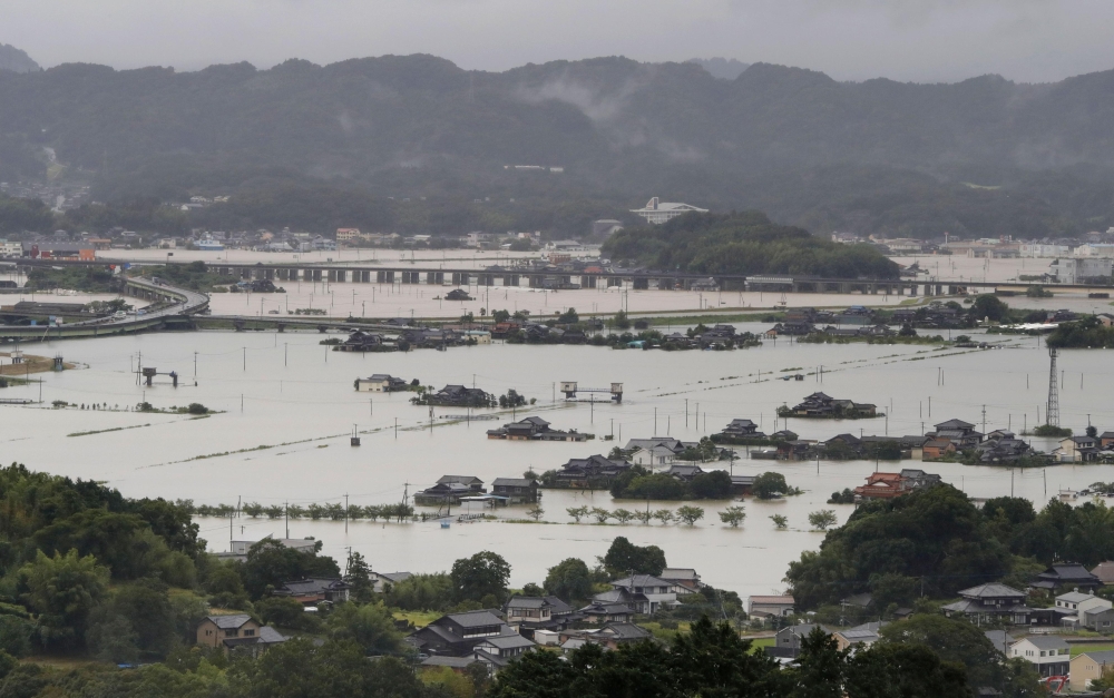 Flooded residential area caused by a torrential rain is seen in Takeo, Saga prefecture, Japan, August 14, 2021, in this photo taken by Kyodo. Mandatory credit Kyodo/via REUTERS 