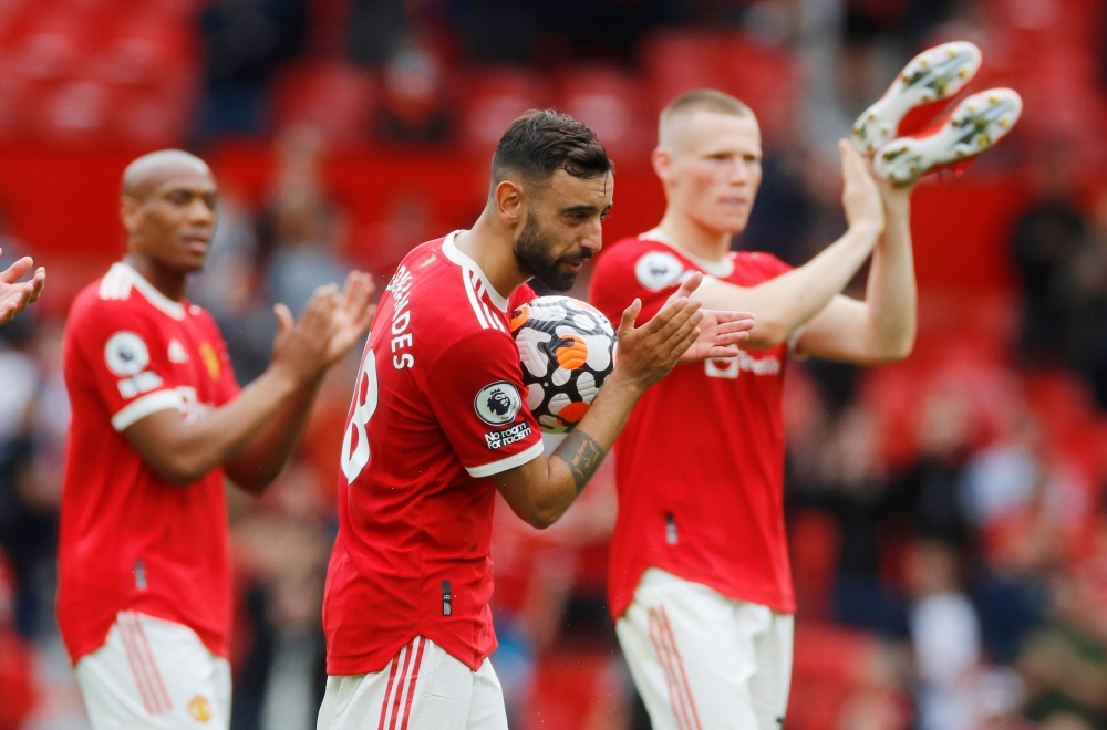 Manchester United's Bruno Fernandes celebrates his hat-trick. REUTERS/Phil Noble