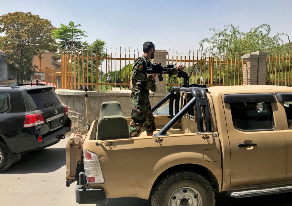 An Afghan soldier stands in a military vehicle on a street in Kabul, Afghanistan, August 15, 2021. Reuters/Stringer