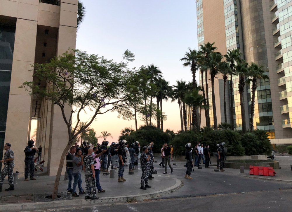 Riot police are deployed during clashes with protesters outside the home of Prime Minister-designate Najib Mikati in Beirut, following a fuel tank explosion in northern Lebanon, August 15, 2021. REUTERS/Issam Abdallah