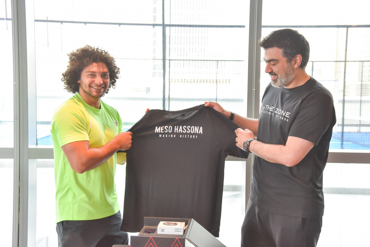 Aura Group CEO Naveed Dolachahi honours Qatari weightlifter Fares Ibrahim at The Zone Gym in Lusail.