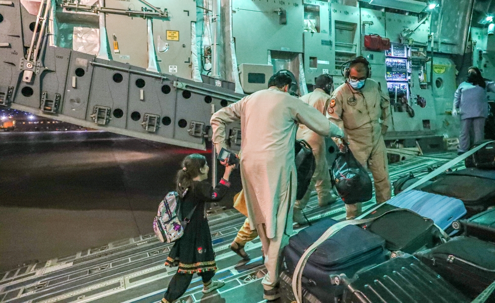 Evacuees from Afghanistan arrive at Al-Udeid airbase in Doha, Qatar in this recent undated handout. Government Communications Office of the State of Qatar/Handout via Reuters