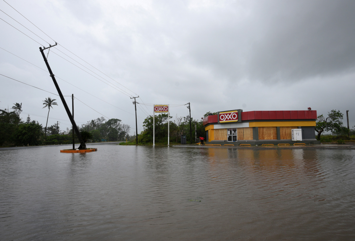 A road next to a convenience store is flooded after Hurricane Grace slammed into the coast with torrential rains, in Costa Esmeralda, near Tecolutla, Mexico August 21, 2021. REUTERS/Yahir Ceballos

