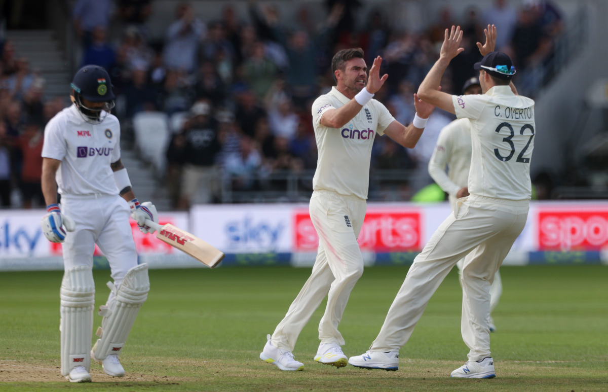 Cricket - Third Test - England v India - Headingley, Leeds, Britain - August 25, 2021 England's James Anderson celebrates taking the wicket of India's Virat Kohli with England's Craig Overton Action Images via Reuters/Lee Smith
