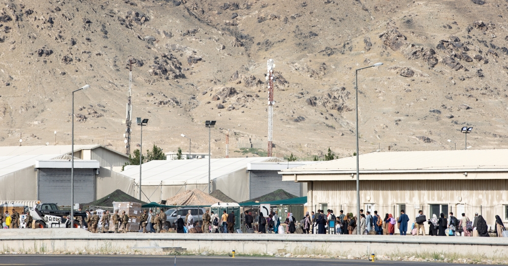 File Photo: Australian citizens and visa holders queue up to board the Royal Australian Air Force C-17A Globemaster III aircraft, as Australian Army infantry personnel provide security, at Hamid Karzai International Airport in Kabul, Afghanistan August 22