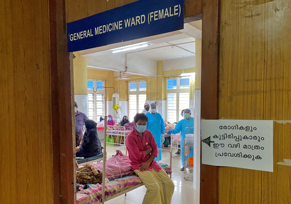 A man looks out from a coronavirus disease (COVID-19) ward in the Government Medical College Hospital in Manjeri, in the Malappuram district of the southern state of Kerala, India. August 18, 2021. Picture taken August 18, 2021. REUTERS/Krishna N. Das
