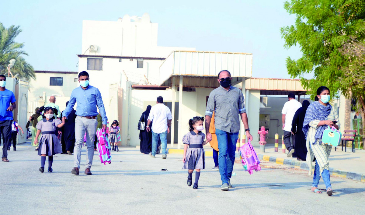 Parents taking their children to MES Indian School.