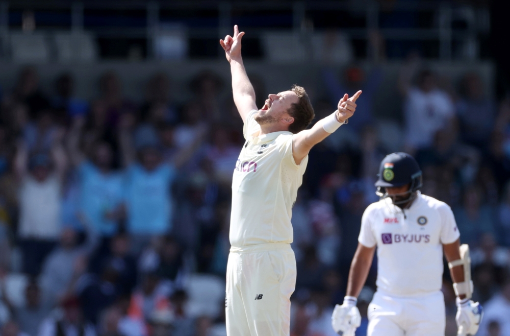 England's Ollie Robinson celebrates after taking the wicket of India's Ishant Sharma Action Images via Reuters/Carl Recine