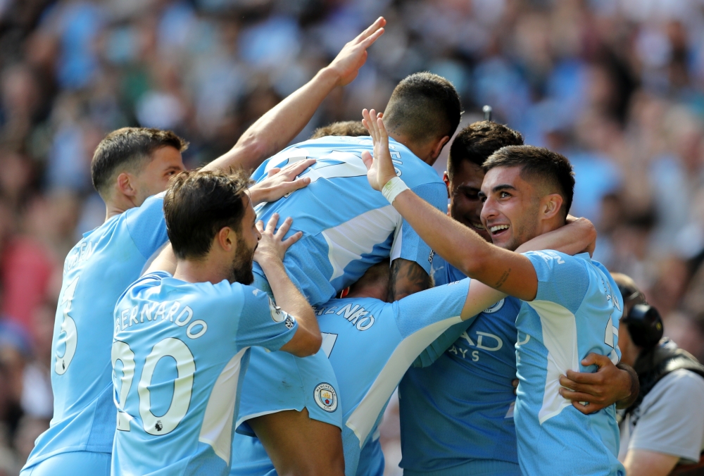 Manchester City's Rodri celebrates scoring their fourth goal with teammates REUTERS/Russell Cheyne 