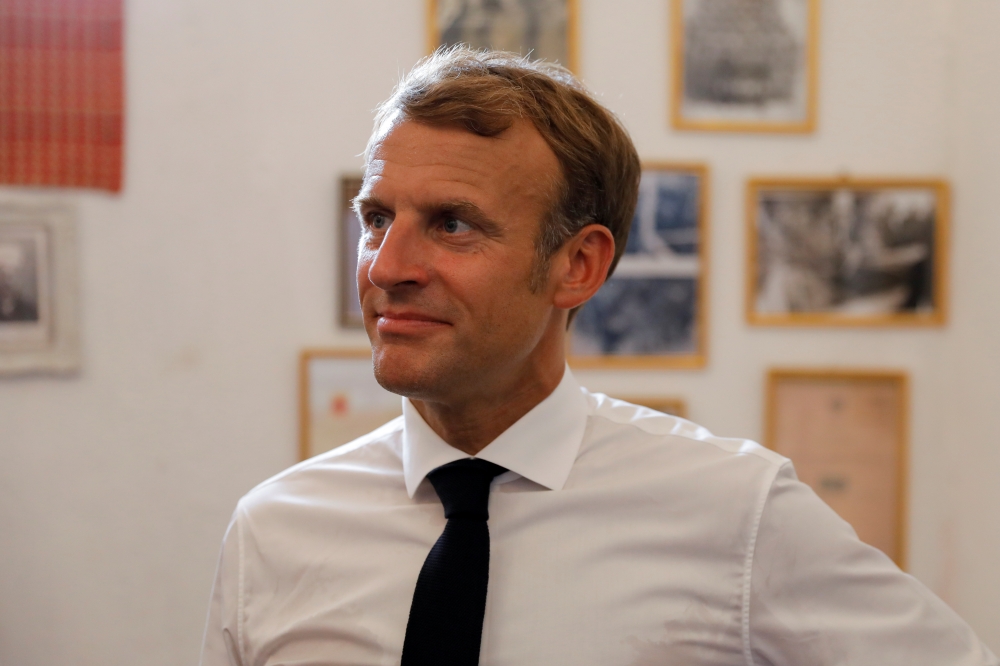 French President Emmanuel Macron visits Bytna Foundation for Culture, Arts and Heritage in the Old City of Mosul, Iraq, August 29, 2021. REUTERS/Abdullah Rashid