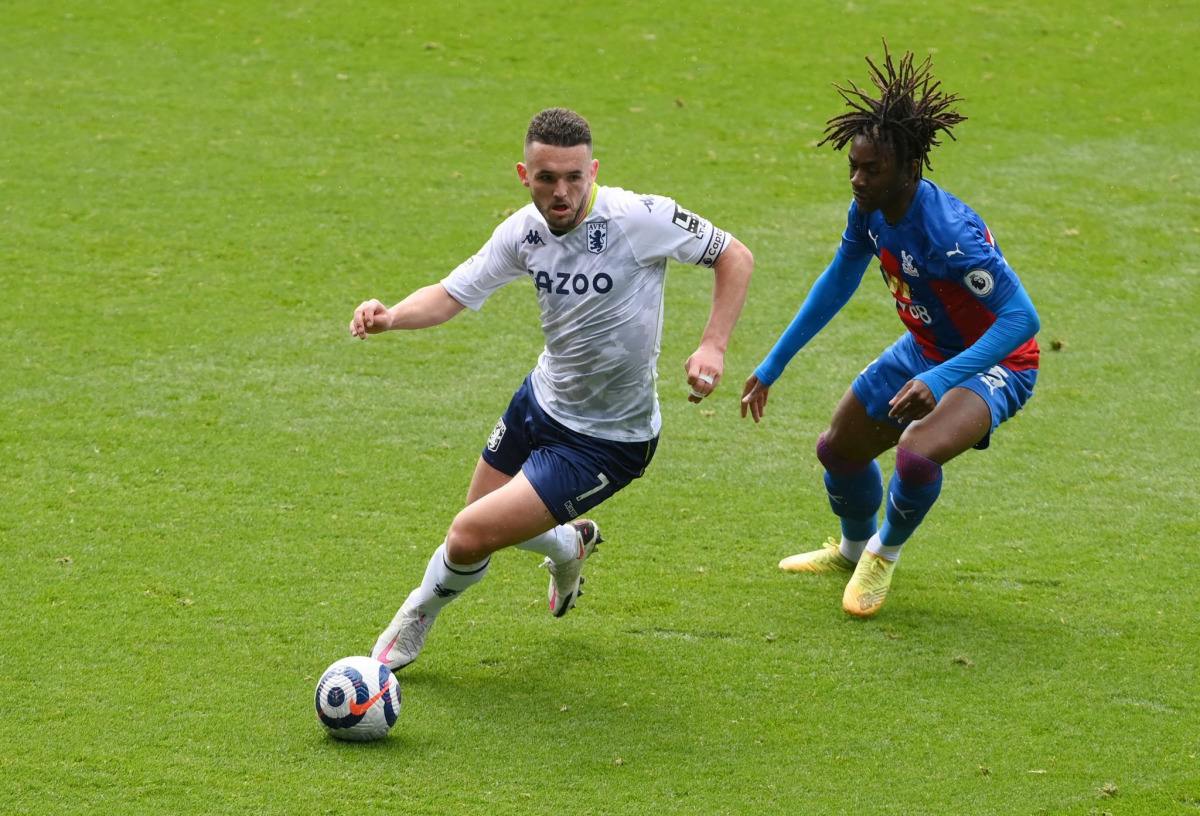 FILE PHOTO: Soccer Football - Premier League - Crystal Palace v Aston Villa - Selhurst Park, London, Britain - May 16, 2021 Aston Villa's John McGinn in action with Crystal Palace's Eberechi Eze Pool via REUTERS/Mike Hewitt
