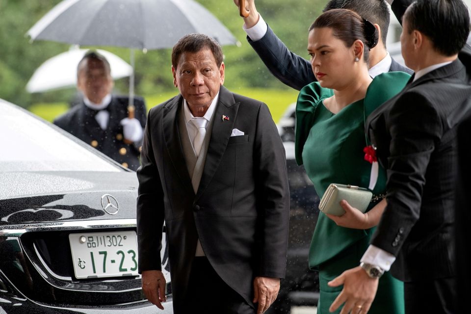 Philippines President Rodrigo Duterte arrives with daughter Sara Duterte-Carpio to attend the enthronement ceremony of Japan's Emperor Naruhito in Tokyo, Japan October 22, 2019. Carl Court/Pool via REUTERS/File Photo