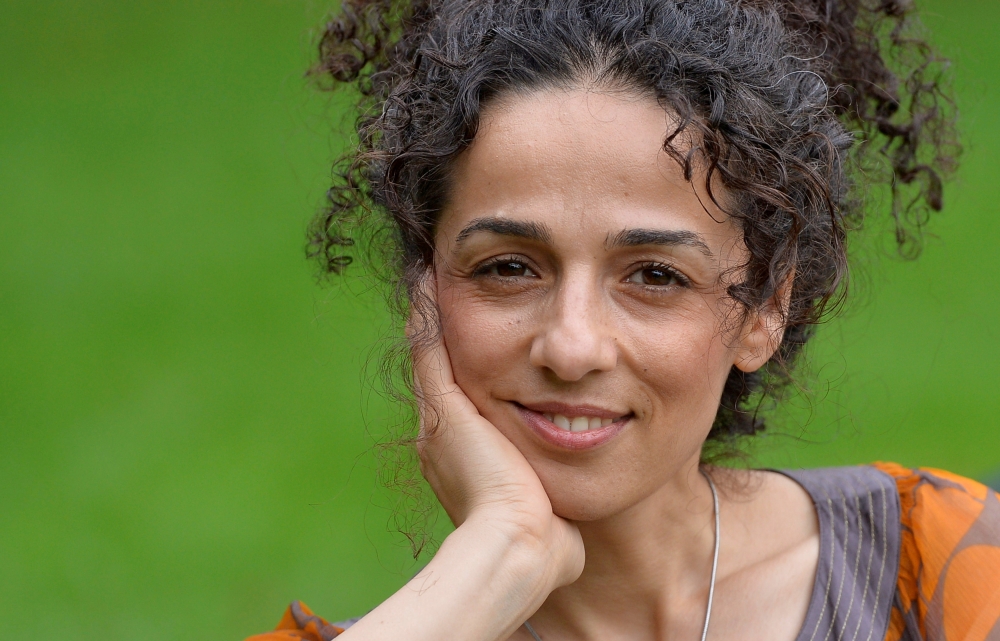 FILE PHOTO: Masih Alinejad, 37, Iranian journalist, poses for a portrait in London October 8, 2013. REUTERS/Toby Melville/File Photo