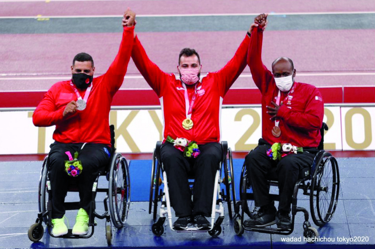 Qatar's Abdulrahman Abdulqader (right), Jordan’s Ahmed Hindi and Morocco’s Izz Eddin Al Nouiri, the medal winners of the men's shot put - F34 event at the Tokyo 2020 Paralympics, celebrate on the podium, yesterday.