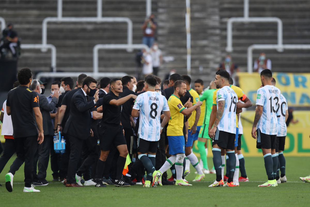 Soccer Football - World Cup - South American Qualifiers - Brazil v Argentina - Arena Corinthians, Sao Paulo, Brazil - September 5, 2021 Players and officials are seen on the pitch as play is interrupted after Brazilian health officials objected to the par