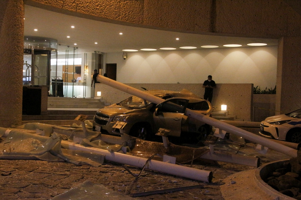 A car damaged during a quake is pictured at the Hotel Emporio in Acapulco, Mexico September 7, 2021. Picture taken September 7, 2021. REUTERS/Stringer