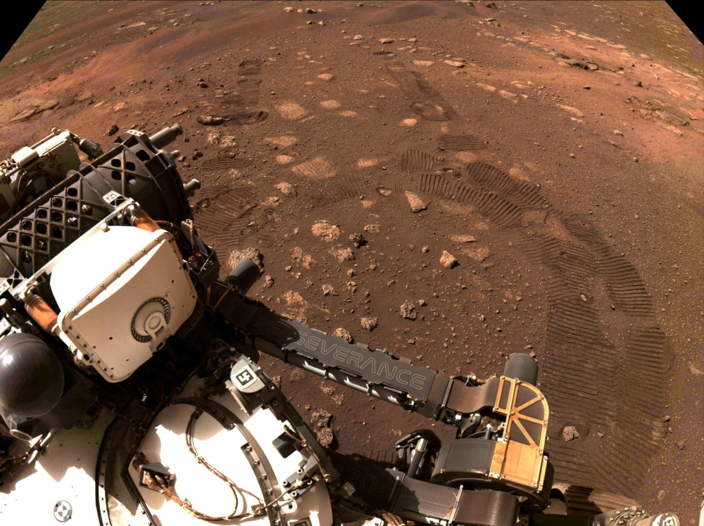 Wheel tread marks are left in the soil of Jezero Crater on Mars, as NASA's Mars rover Perseverance drives on Martian surface for the first time, in this March 4, 2021 image supplied to Reuters. Image taken March 4, 2021. NASA/JPL-Caltech/Handout via REUTE