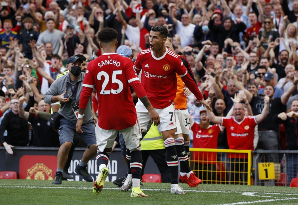 Manchester United's Cristiano Ronaldo celebrates scoring their second goal with Jadon Sancho REUTERS/Phil Noble 