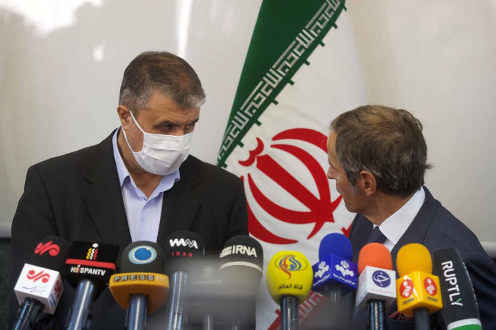 Head of Iran's Atomic Energy Organization Mohammad Eslami and International Atomic Energy Agency (IAEA) Director General Rafael Grossi attend a news conference, in Tehran, Iran, September 12, 2021. 