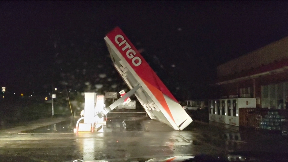 A CITGO gas station roof is blown away by Tropical Storm Nicholas in Matagorda, Texas, U.S. in this still image from a social media video taken on September 13, 2021. Andrew Dubya/via REUTERS