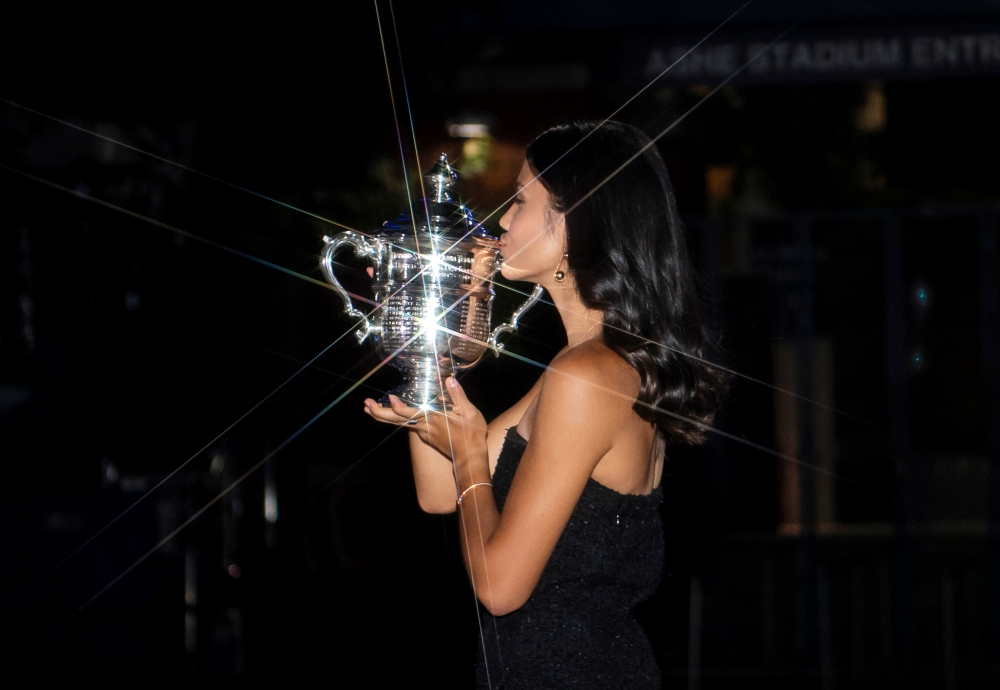 Britain's Emma Raducanu poses with the U.S. Open tennis championship trophy in New York, U.S., September 11, 2021. Michael Frey/Handout via Reuters