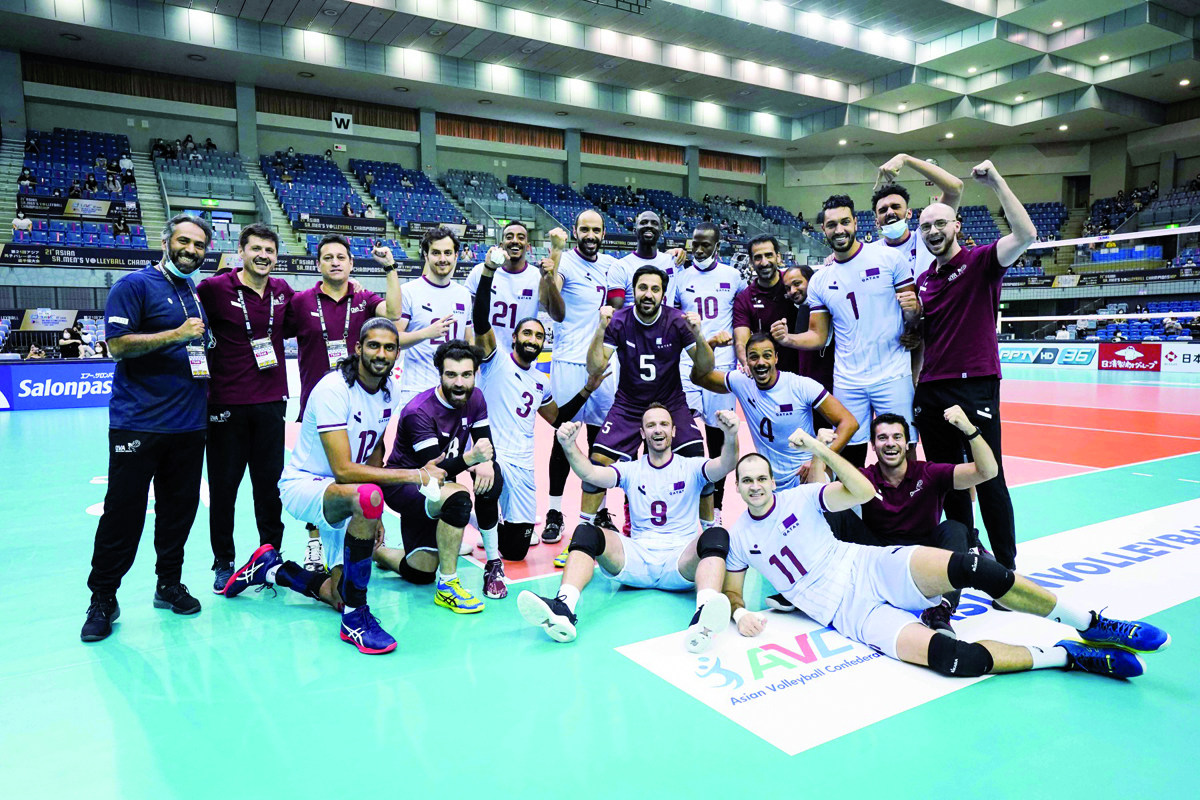 Qatar players and officials celebrate after defeating Australia in straight sets yesterday.