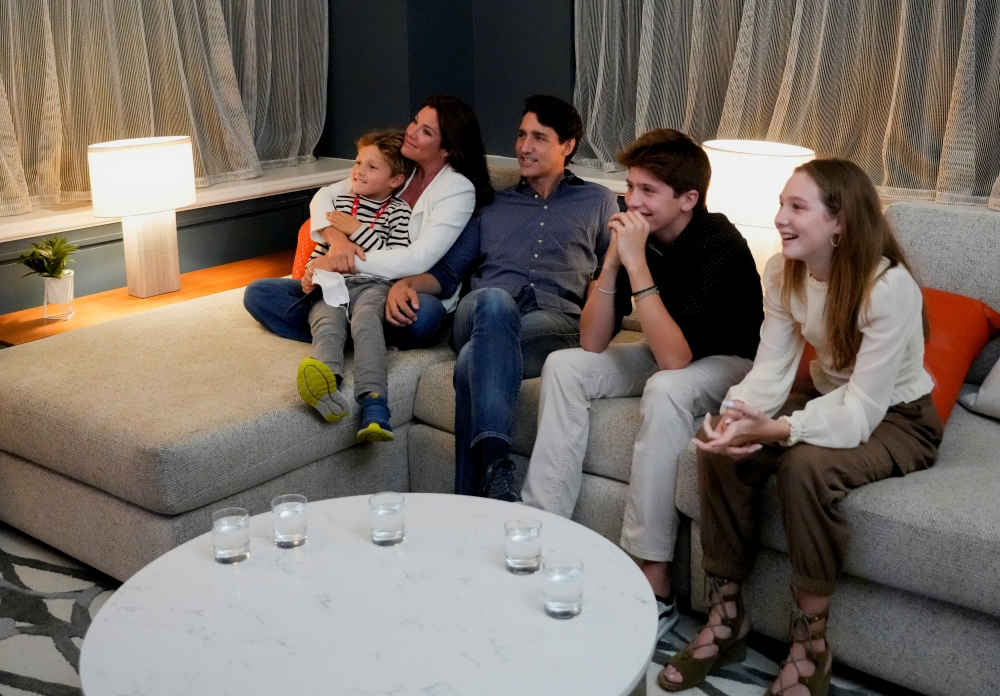 Canada's Liberal Prime Minister Justin Trudeau, accompanied by his wife Sophie Gregoire and his children Ella-Grace, Xavier and Hadrien watch the election coverage on TV, in Montreal, Quebec, Canada, September 20, 2021. Reuters/Carlos Osorio