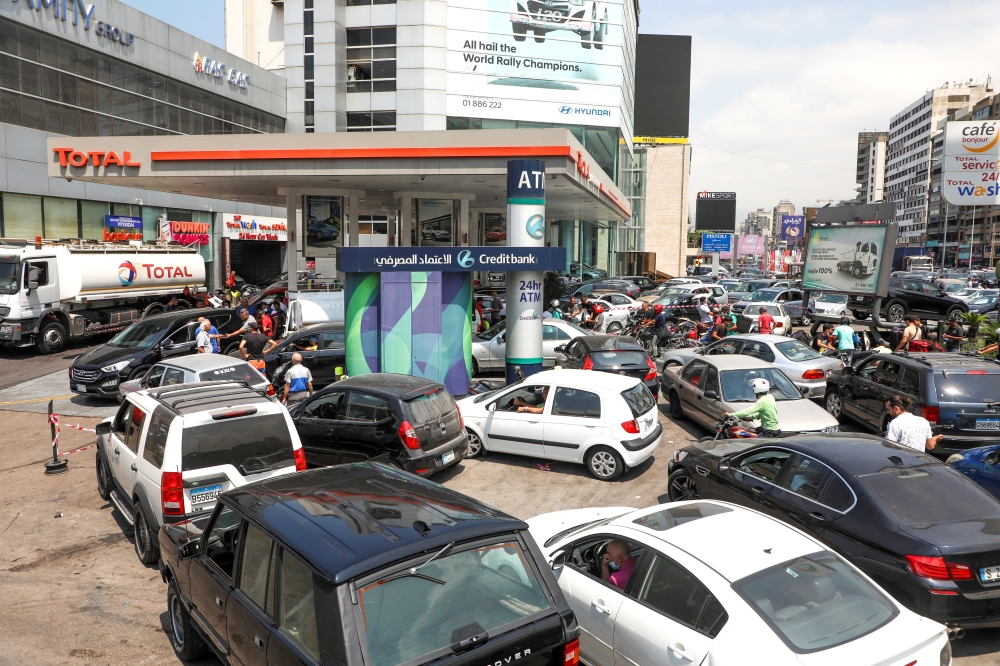 FILE PHOTO: People wait in cars to get fuel at a gas station in Zalka, Lebanon, August 20, 2021. Picture taken August 20, 2021. REUTERS/Mohamed Azakir